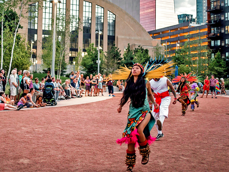 A Native American dance group performs in The Commons