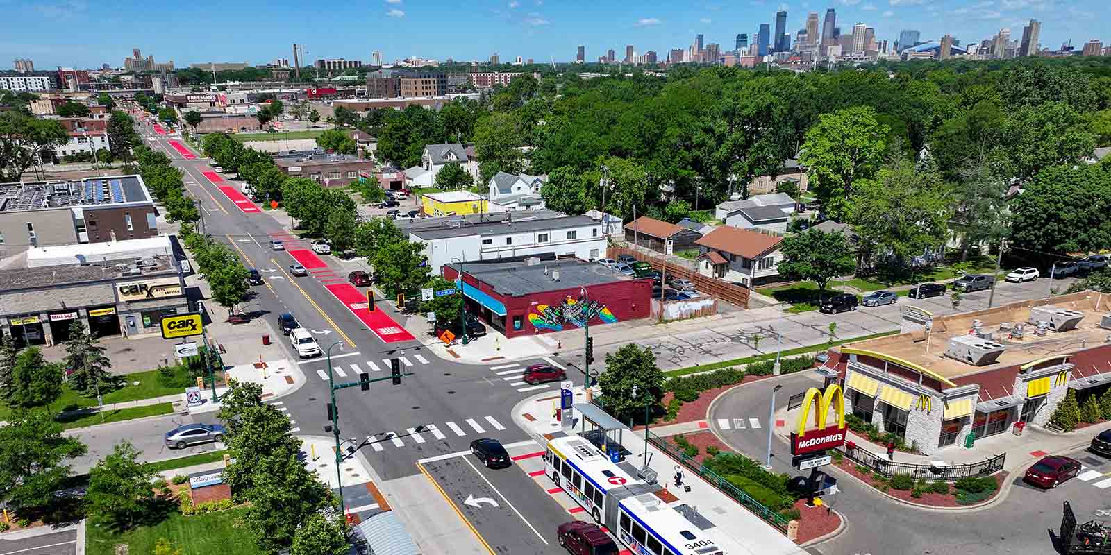 An aerial image of a Metro Transit bus on a red bus lane along East Lake Street