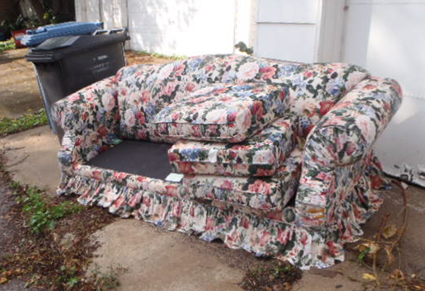 couch set out for garbage pickup