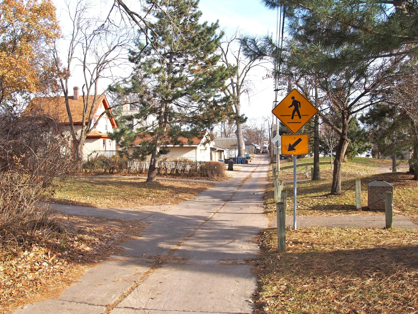 Sidewalk with walk sign