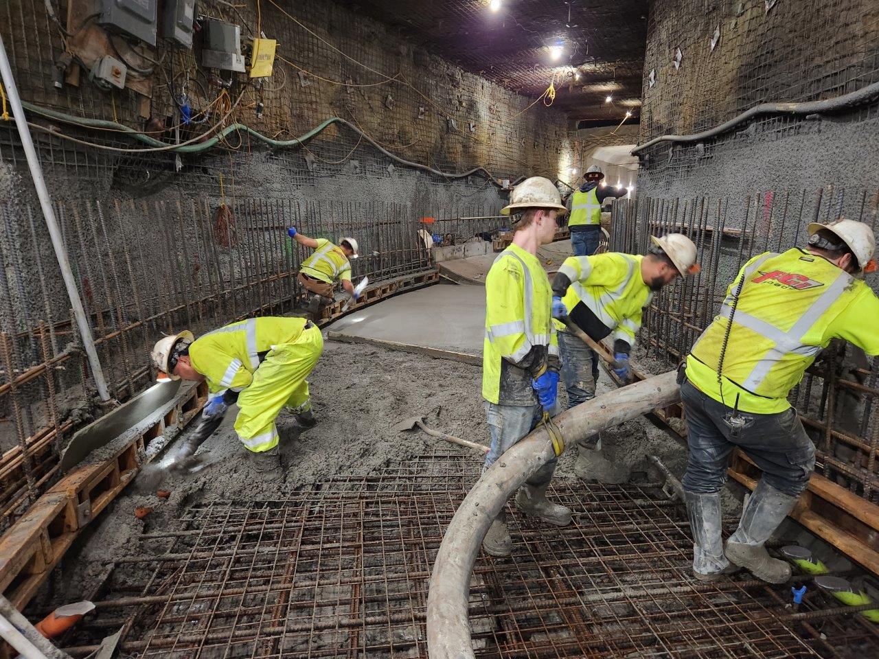 Workers add concrete