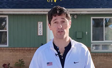 Mayor Jacob Frey speaking in front of Minneapolis home