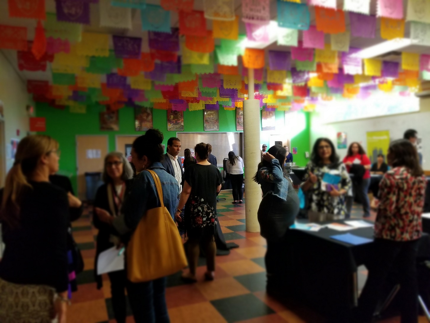 People gathering inside decorated room