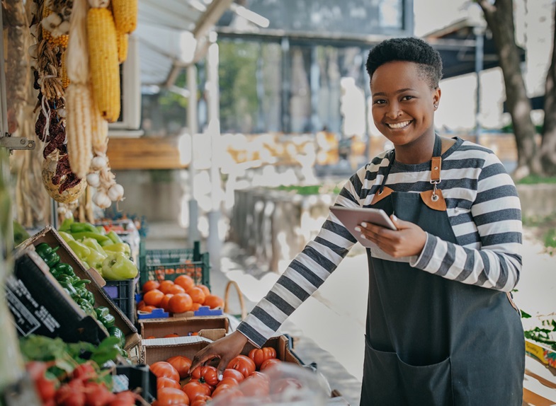 Farmers market manager with notepad