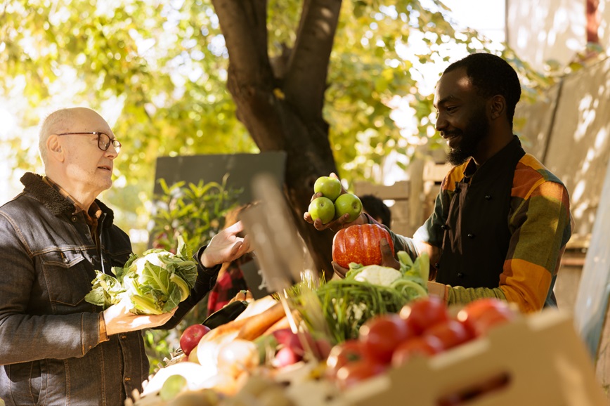 Farmers market vendor and customer talking