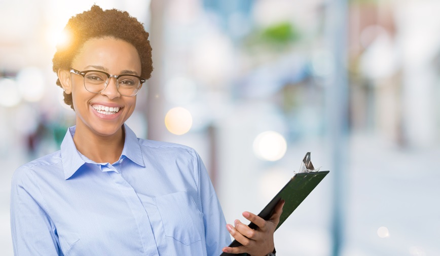 Smiling person with clipboard