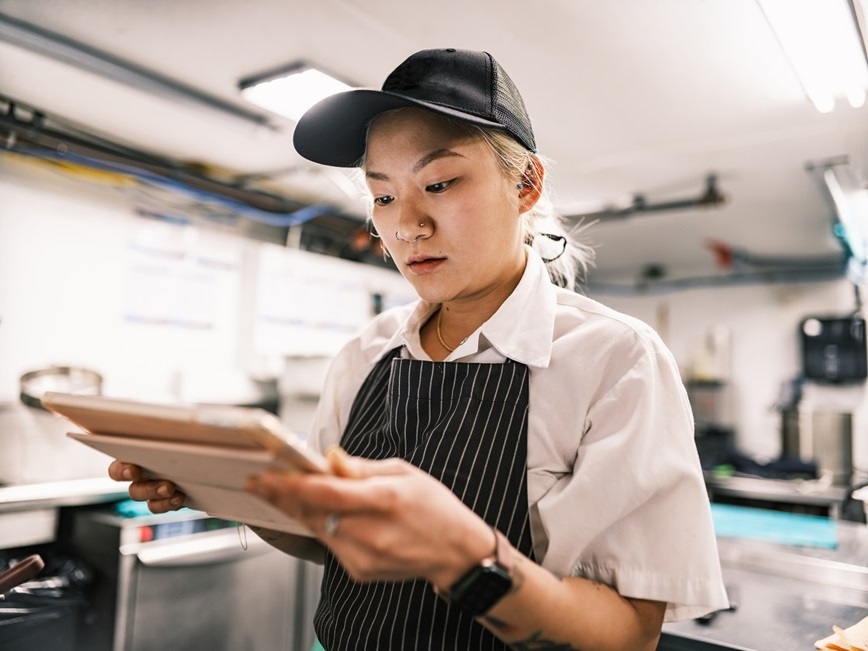 Restaurant employee reading procedure