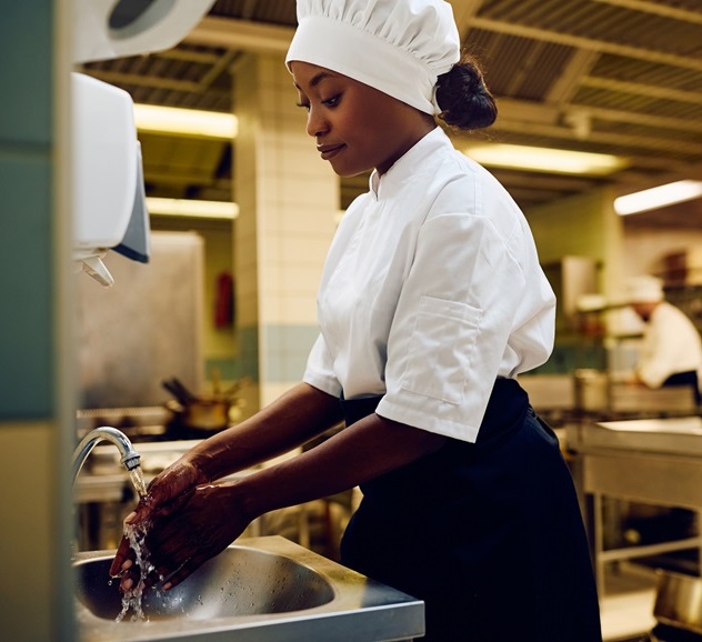 Restaurant chef washing hands