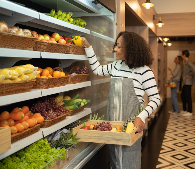 Store employee with produce