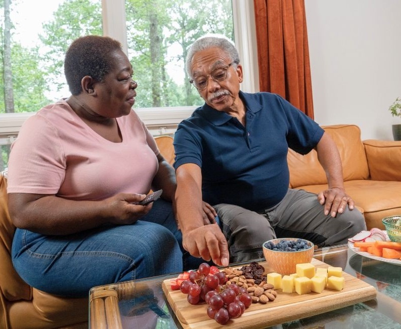 Two adults eating healthy food Two adults eating healthy food