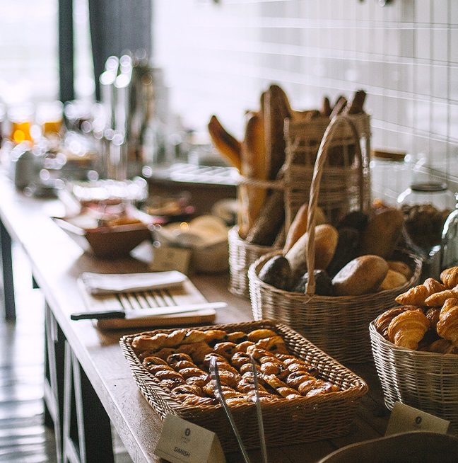 Catering bread and pastries on table