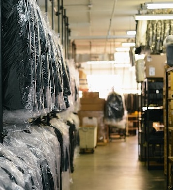 clothing hanging in dry cleaner business