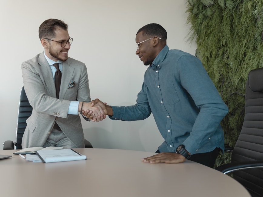 shaking hands after business transaction