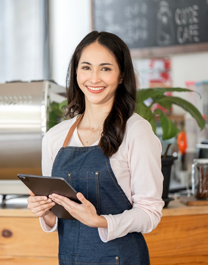 Person holding clipboard in cafe