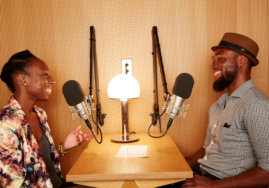 A person sharing their story privately in a recording booth.