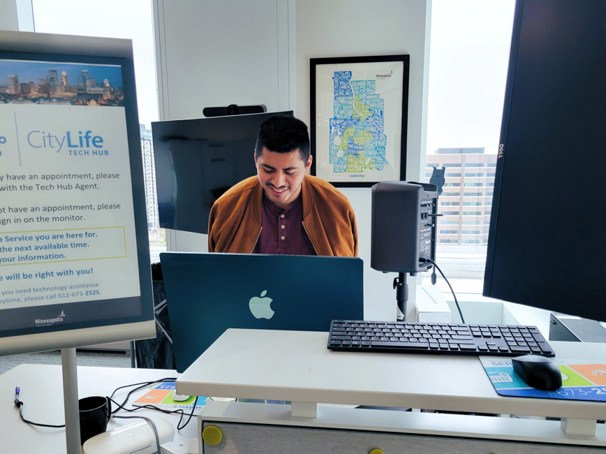 Tech hub employee working at laptop